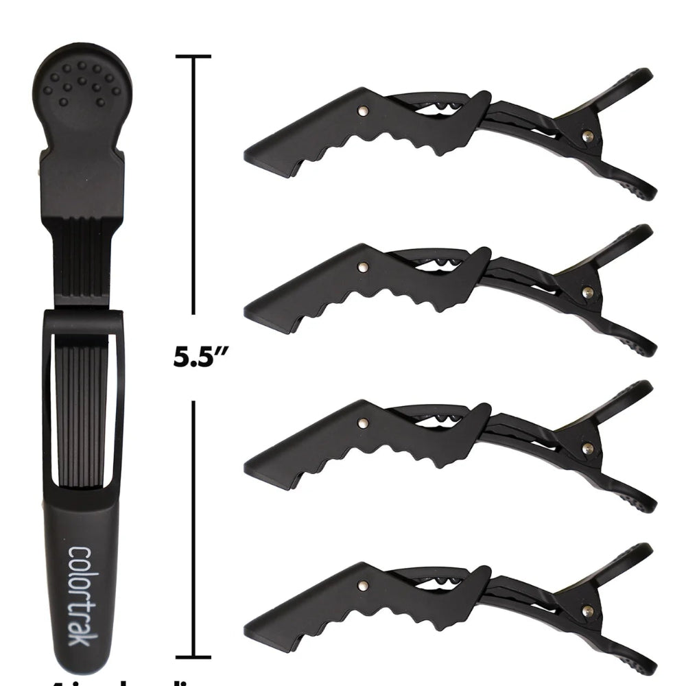 Black hair clip set with four jumbo clips and a measuring scale on a white background