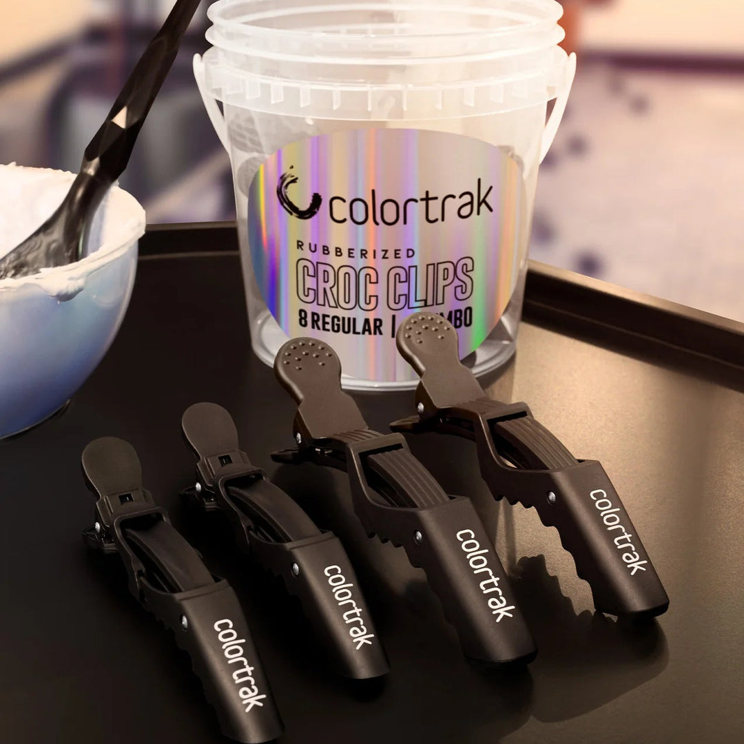 Colortrak croc clips with a container on a table