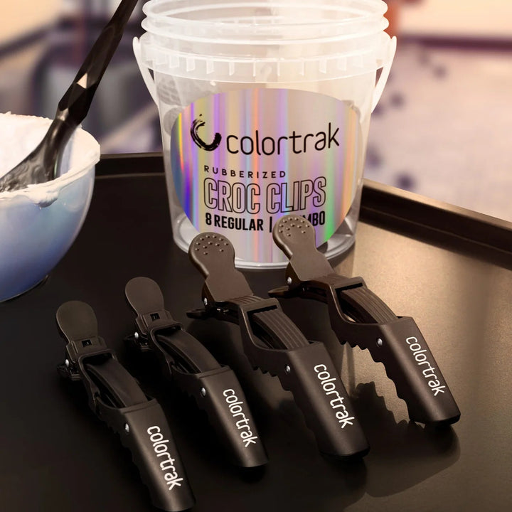 Colortrak croc clips with a container on a table