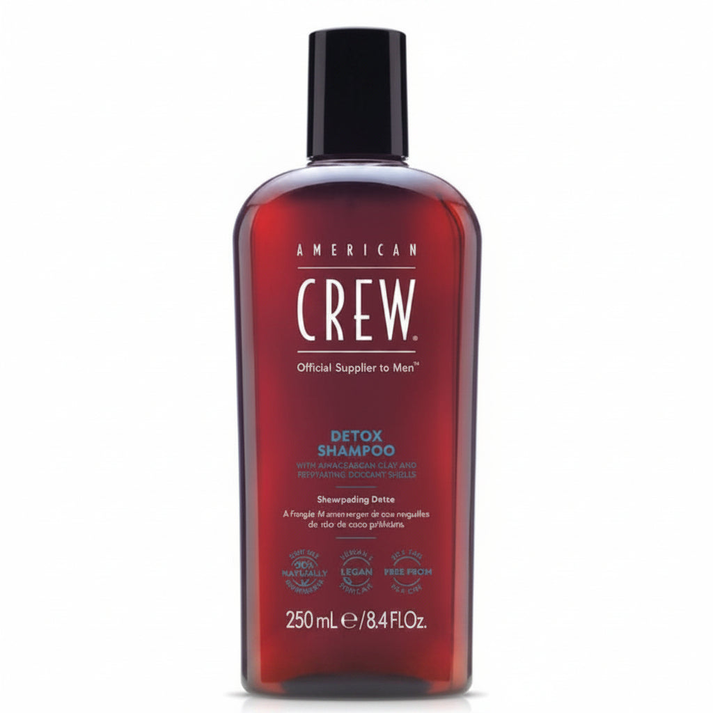 Red shampoo bottle with black cap on a white background